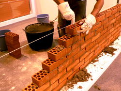 Handyman doing Masonry with bricks