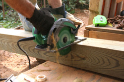 Handyman cutting a 4x4 with a circular saw